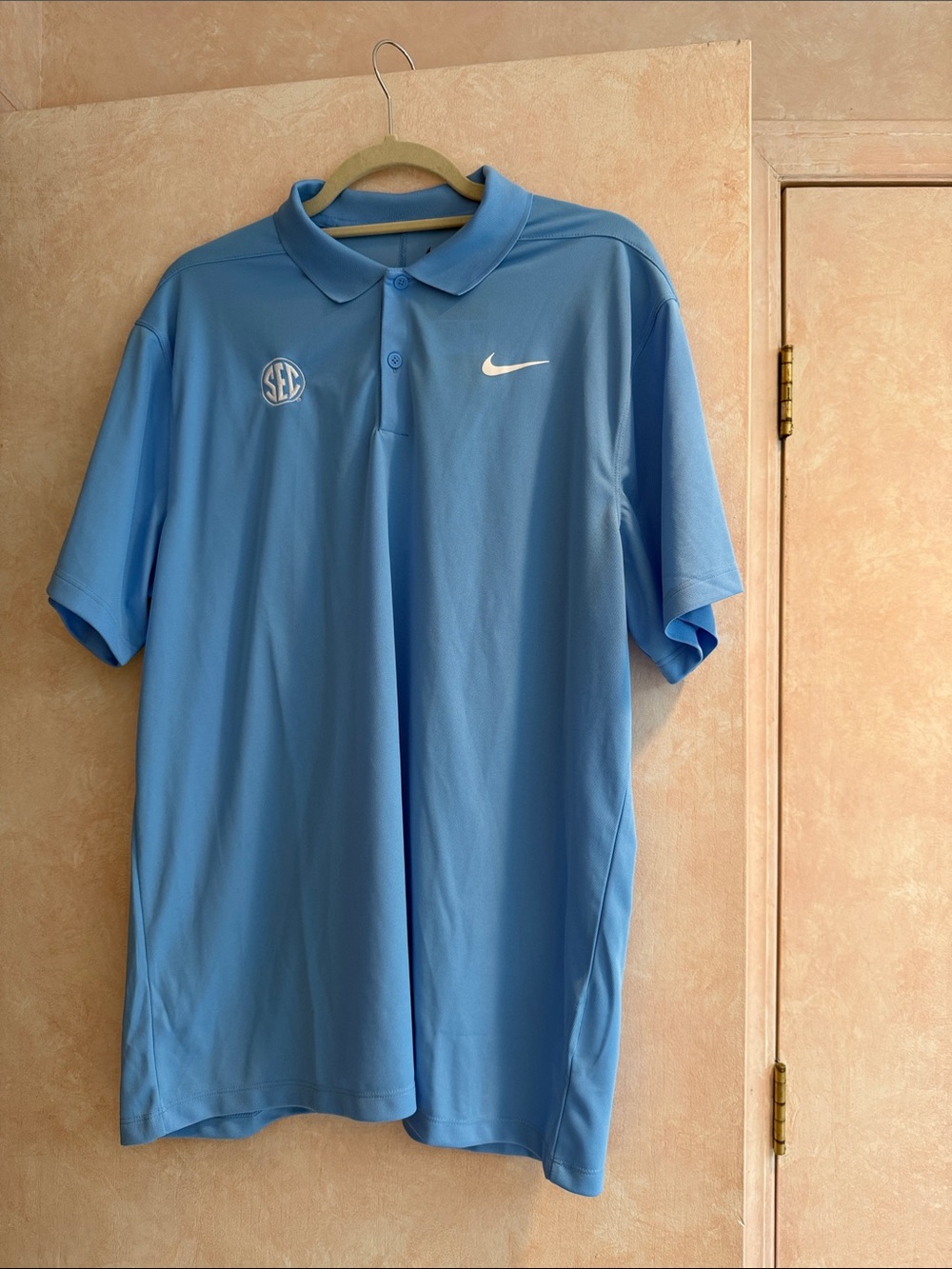 Nike Men’s Carolina Blue Dri-FIT Polo with SEC Patch